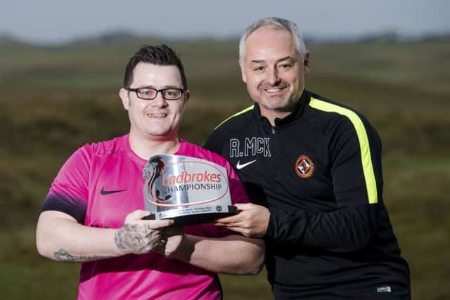 Tommy McKay receiving his award with Dundee United boss Ray McKinnon. Picture: SNS