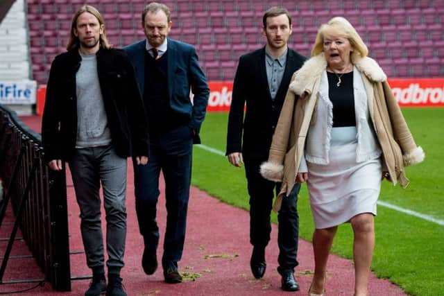 New head coach Ian Cathro, second right, and his assistant Austin MacPhee, left, with Hearts owner Ann Budge and chief operating officer Scot Gardiner. Picture: SNS Group
