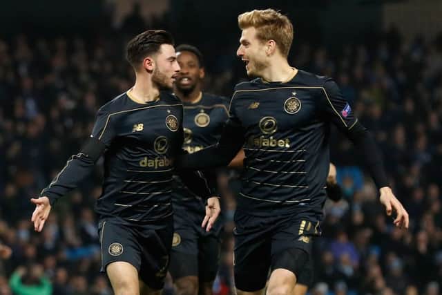 Patrick Roberts (left) celebrates with Stuart Armstrong after opening the scoring. Picture: PA