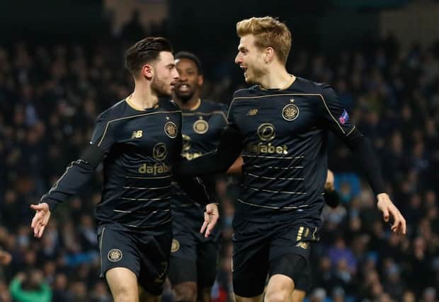 Patrick Roberts (left) celebrates with Stuart Armstrong after opening the scoring. Picture: PA