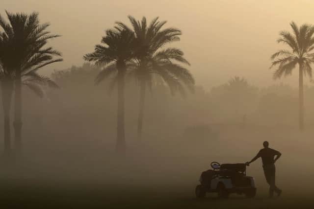 After an early-morning fog delay, play was suspended in the Omega Dubai Ladies Masters after a caddie collapsed and died. Picture: Getty Images