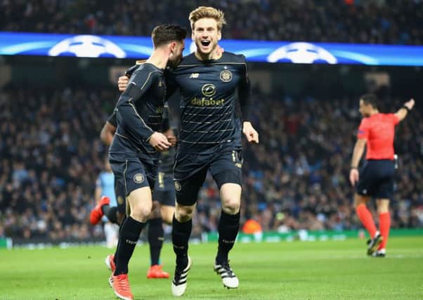 Stuart Armstrong celebrates with Patrick Roberts after the latter had opened the scoring against Manchester City. Picture: Clive Brunskill/Getty Images