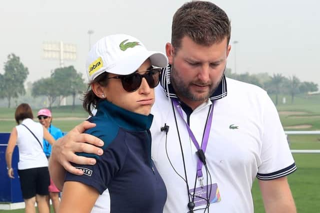Frances Anne-Lise Caudal is consoled by the tournament director Michael Wood in Dubai. Picture: David Cannon/Getty Images