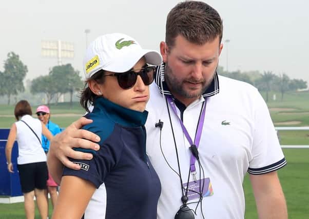 Frances Anne-Lise Caudal is consoled by the tournament director Michael Wood in Dubai. Picture: David Cannon/Getty Images