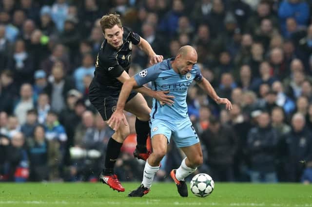 Celtic's James Forrest (left) and Manchester City's Bacary Sagna in action in last night's Champions League match. Picture: Martin Rickett/PA Wire