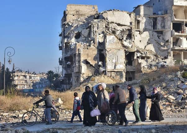 Syrian residents fleeing the violence in the eastern rebel-held parts of Aleppo evacuate their neighbourhoods. Picture: AFP/Getty Images
