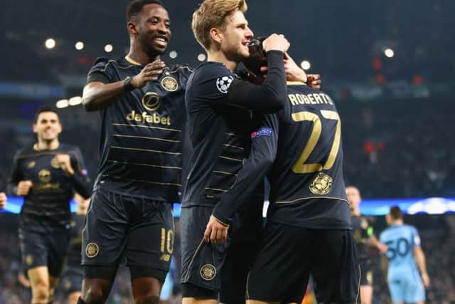 Patrick Roberts celebrates with Moussa Dembele and Stuart Armstrong after putting Celtic ahead at Etihad Stadium on Tuesday night. Picture: Clive Brunskill/Getty Images