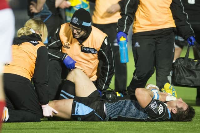 Glasgow Warriors' Peter Horne receives treatment against Munster. Picture: Bill Murray/SNS