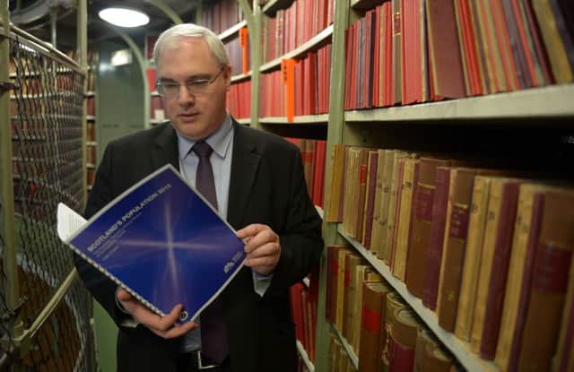 Tim Ellis, chief executive of the National Records of Scotland, browses files at Register House in Edinburgh. Picture: Phil Wilkinson/TSPL