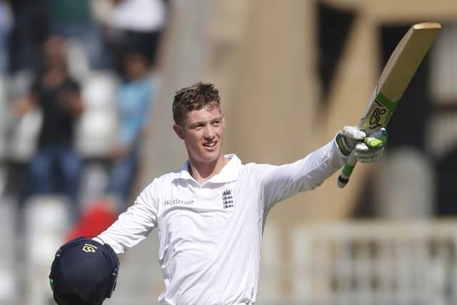 England debutant Keaton Jennings raises his bat after scoring a century on the first day of the fourth Test. Picture: Rafiq Maqbool/AP