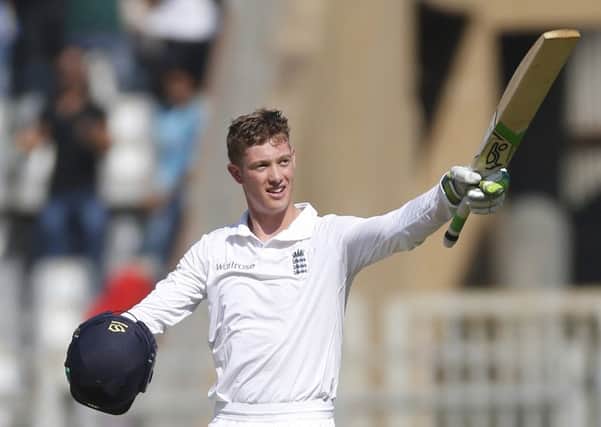 England debutant Keaton Jennings raises his bat after scoring a century on the first day of the fourth Test. Picture: Rafiq Maqbool/AP