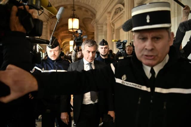 Jerome Cahuzac is escorted from court in Paris. Picture: AFP/Getty Images