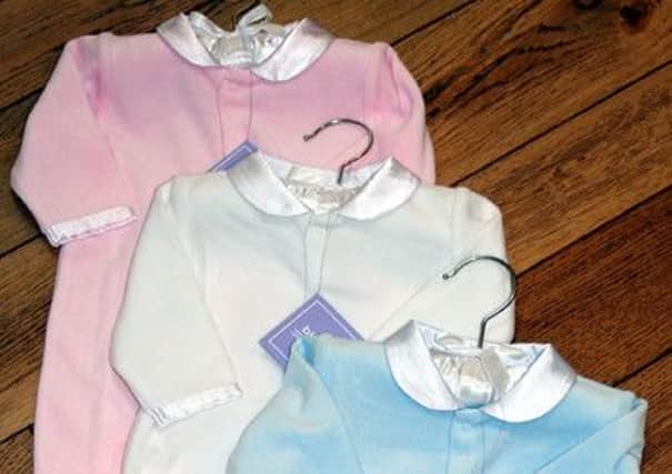 Pink and blue labelling for girls and boys starts at birth.