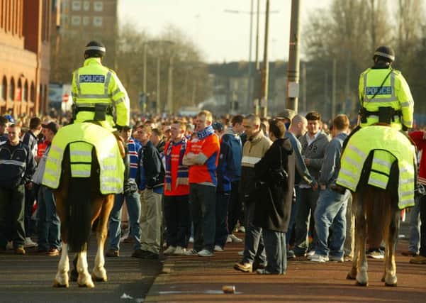 Two mounted police officers control the crowds outside Ibrox.
Picture: Submitted