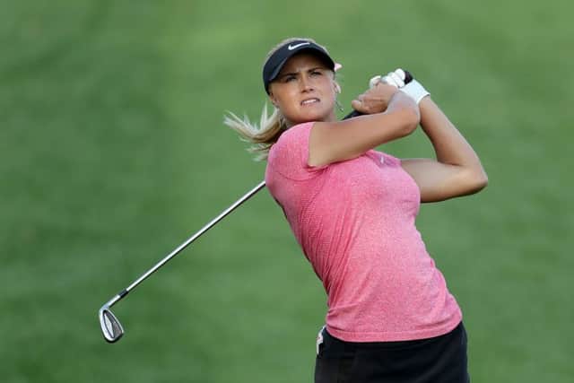 Scotland's Carly Booth plays her second shot at the 14th hole during the delayed second round of the 2016 Omega Dubai Ladies Masters on the Majlis Course at the Emirates Golf Club in Dubai. Picture: David Cannon/Getty Images