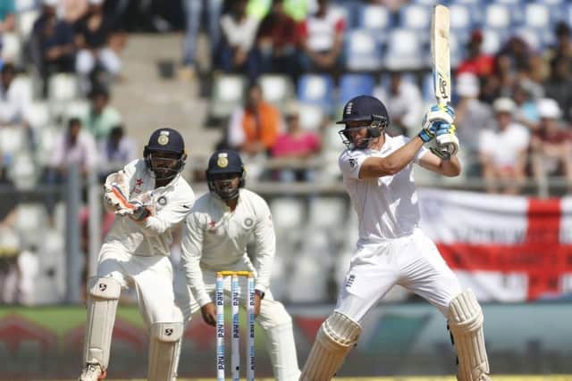 England batsman Jos Buttler plays a cut during his crucial innings of 76 on the second day of thefourth Test in Mumbai. Picture: Rafiq Maqbool/AP