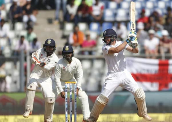 England batsman Jos Buttler plays a cut during his crucial innings of 76 on the second day of thefourth Test in Mumbai. Picture: Rafiq Maqbool/AP