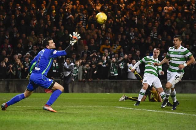 Leigh Griffiths finds the top corner with a curling effort. Picture: SNS