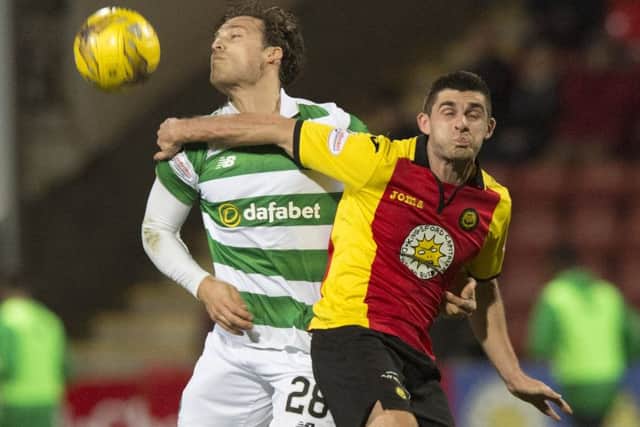 Erik Sviatchenko battles with Kris Doolan as Celtic ran out comfortable 4-1 winners from the Ladbrokes Premiership encounter. Picture: SNS