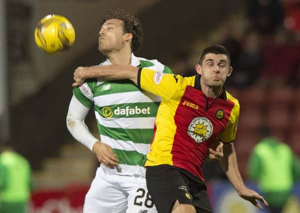 Erik Sviatchenko battles with Kris Doolan as Celtic ran out comfortable 4-1 winners from the Ladbrokes Premiership encounter. Picture: SNS