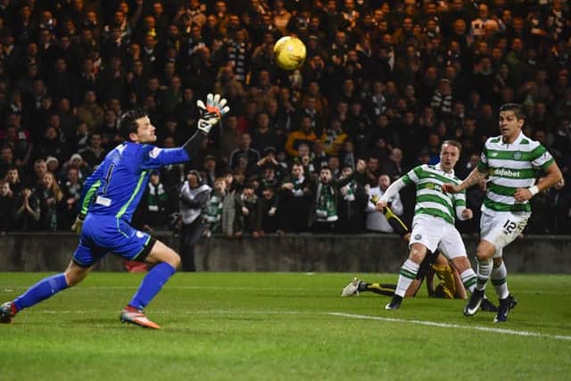 Celtic's Leigh Griffiths netting his side's third goal. Picture: SNS