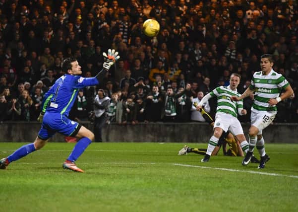 Celtic's Leigh Griffiths netting his side's third goal. Picture: SNS