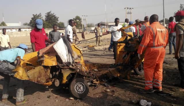 People clear debris after an explosion in Maiduguri, Nigeria. Picture; AP
