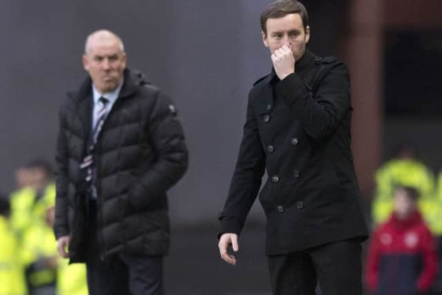 Hearts manager Ian Cathro, right, instructs his Hearts side from the side of the Ibrox pitch. Picture: Craig Williamson/SNS