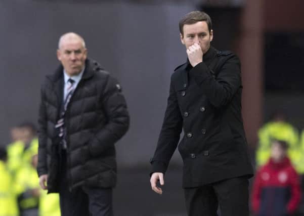 Hearts manager Ian Cathro, right, instructs his Hearts side from the side of the Ibrox pitch. Picture: Craig Williamson/SNS
