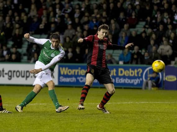 Hibernian's Brian Graham, left, scores his side's second goal of the afternoon. 
Picture: Alan Rennie/SNS