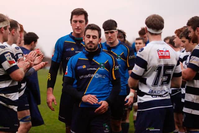 Boroughmuir players come off the pitch dejected after the defeat