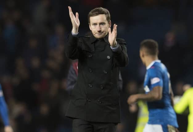 Hearts manager Ian Cathro applauds the fans at full-time