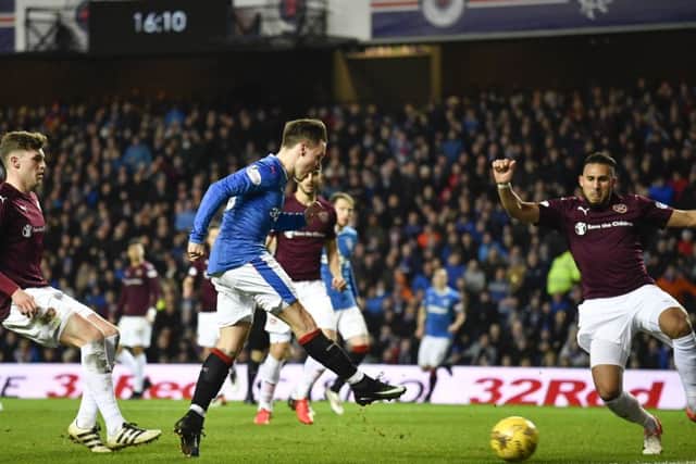 Barrie McKay drillsd the ball into the net following some dreadful Hearts defending. Picture: SNS.