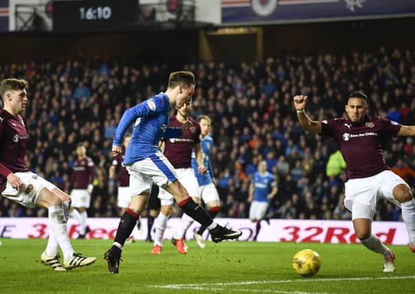 Barrie McKay  drillsd the ball into the net following some dreadful Hearts defending. Picture: SNS.