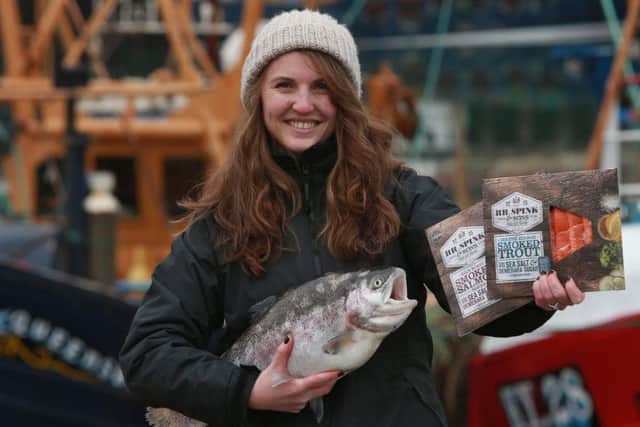 RR. Spink & Sons sales executive Alisha Goodwin celebrates the deal in Arbroaths harbour. Picture: Contributed