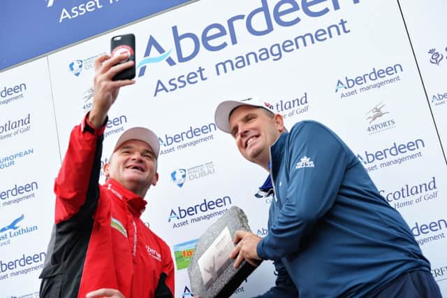 Tournament host Paul Lawrie takes a selfie with winner Anthony Wall at Archerfield Links. Picture: Mark Runnacles/Getty Images