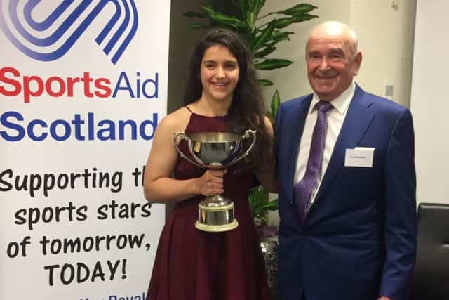 Georgia collects her Miquel Trophy from Raymond Miquel.