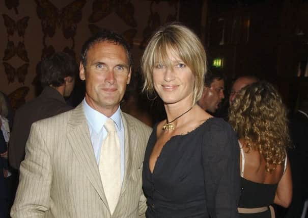 Columnist AA Gill with  his fiancee and partner of 25 years Nichola Formby.