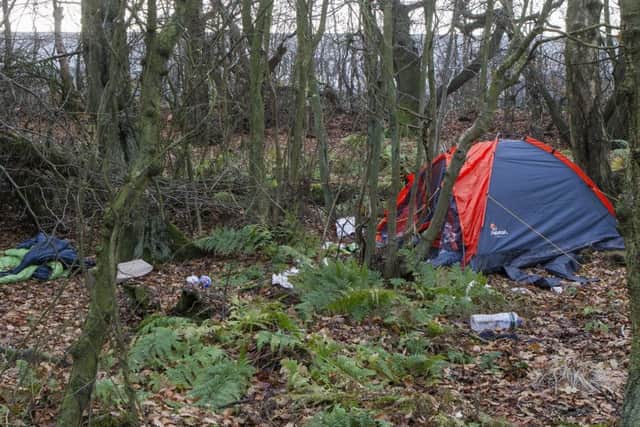 A shift worker at Amazon Dunfermline has pitched up a tent in woods next to the depot. Picture: SWNS