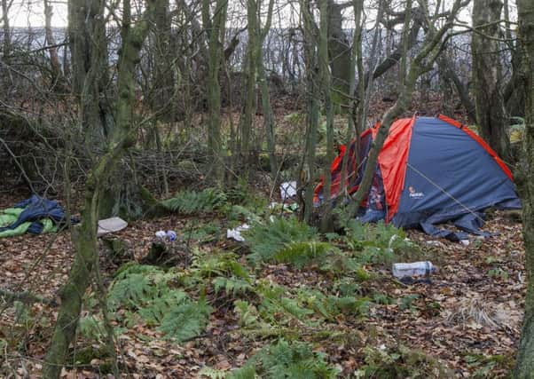 A shift worker at Amazon Dunfermline has pitched up a tent in woods next to the depot. Picture: SWNS