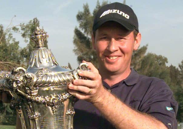 Scotland's Gary Orr shows off the trophy after winning the Portuguese Open in 2000. Picture: Gael Cornier/AP