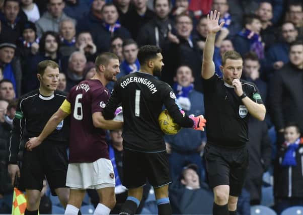 Referee John Beaton rules out Don Cowie's 16th-minute goal at Ibrox for offside.