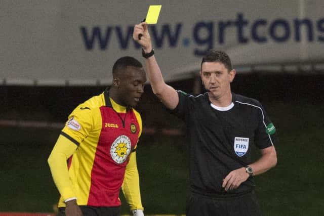 Ade Azeez, left, was booked for diving in Partick Thistle's 4-1 loss against Celtic on Friday. Picture: SNS
