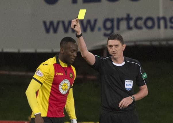 Ade Azeez, left, was booked for diving in Partick Thistle's 4-1 loss against Celtic on Friday. Picture: SNS