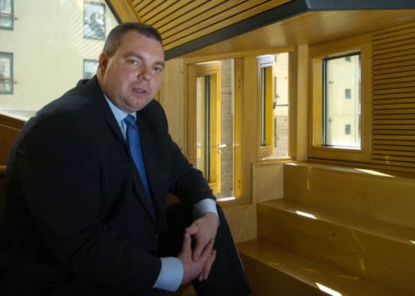 For Business:
Mechanical windows in the parliament are going to be kept open overnight. Pictured is Alex Johnstone, Consevatives MSP, in his office beside the manual and mechanical windows. 
Pic by Cate Gillon
15/6/05