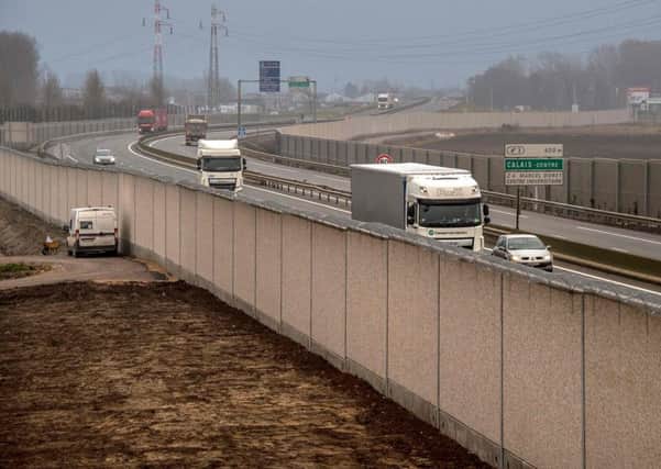 Four-metre-high wall, running along a kilometre-long stretch of the main road leading to Calais port. Picture: AFP PHOTO / PHILIPPE HUGUENPHILIPPE HUGUEN/AFP/Getty Images