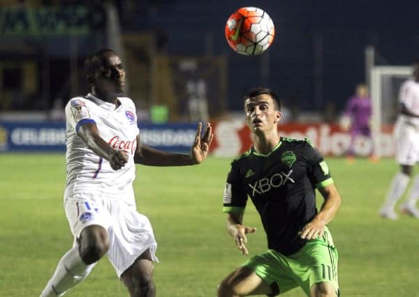 Aaron Kovar of Seattle Sounders, right, is to have a trial with Hibs. Picture: STR/AFP/Getty Images