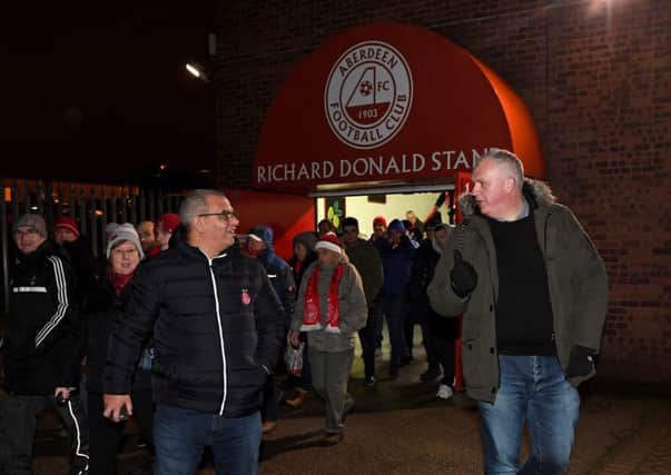 Aberdeen supporters leave Pittodrie after the game was abandoned due to floodlight failure. Picture: Craig Williamson/SNS