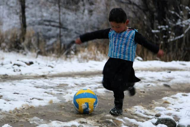 Murtaza pictured wearing the homemade Messi shirt. Picture: AFP/Getty Images