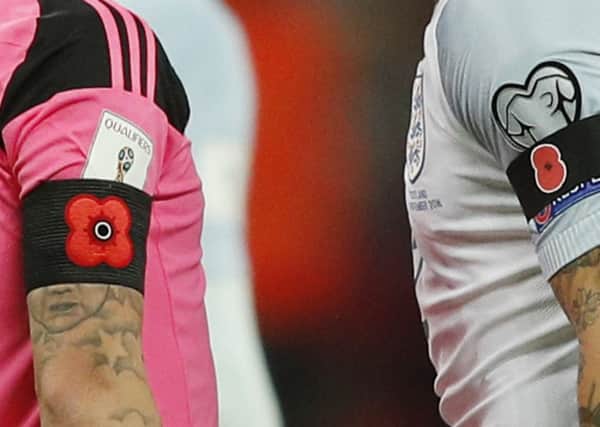 Poppy armbands were worn by both Scotland and England players during the match. Picture: Getty